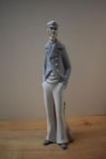 A Lladro porcelain figure, 'Sea Captain' model number 4621, measuring 37cm tall, damaged pipe from