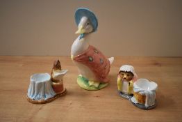 A group of three Beatrix Potter ceramic characters comprising 'Jemima Puddleduck' money bank, 'Mrs