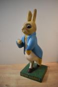 A rare 1950's cast composite Peter Rabbit shop display advertising figure, mounted on square base,
