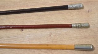 Military Swagger Sticks with white metal pommel on metal-tipped wooden cane, overall 69cm, one