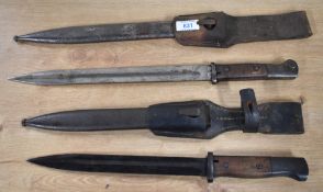 German K98 bayonets, the first having a single-edged fullered blackened 25cm blade, with ricasso