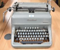 Vintage post-WW2 Blue Bird Solitaire typewriter in grey, made in Germany U.S. Zone by Blue Bird
