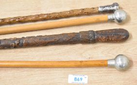 Military Swagger Sticks with white metal 'ball-head' pommel on metal-tipped cane, overall 65/67cm,