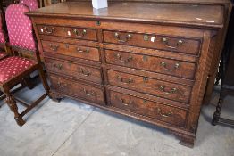 A 19th Century oak mule chest having lift lid and faux drawers (top two rows) with four drawers to