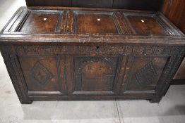 A period oak kist of panelled form , with carved decoration to front, and monogram RP, dimensions