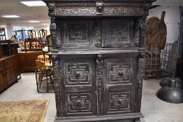 An impressive period oak court cupboard , with figural carving throughout including 'Jacob, Lia,