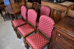A harlequin set of six early 20th Century oak dining chairs