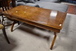 A vintage walnut coffee table, approx. 114 x 57cm