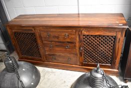 A modern hardwood sideboard, width approx. 173cm