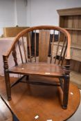 A late Victorian mahogany low seat carver chair having panel and stick back with fiddle style