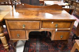 An early to mid 20th Century walnut kneehole desk/dressing table, width approx. 107cm