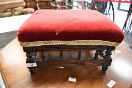 A Victorian footstool having bobbin turned frame