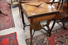 A Victorian envelope style card table having inlaid decoration and green baize top, approx width.