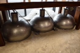 A set of three modern industrial style ceiling light fittings, approx. 70cm diameter