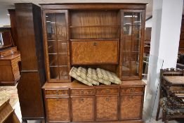 A 1980's burr-wood veneer/effect room unit with an arrangement of drawers, cupboard doors and