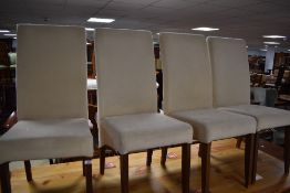 A set of four modern suedette dining chairs