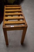 A modern light oak luggage rack, of slatted construction 45cm x 55cm x 30cm