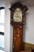A late 19th or early 20th Century mahogany long case clock having partially gilt heightened pillar