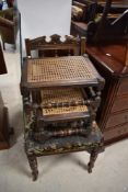 A Victorian oak dining chair and two canework footstools