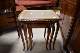A nest of three vintage tables in the period style