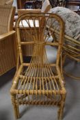 A vintage bamboo dining chair