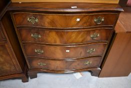 A reproduction (Reprodux) serpentine front chest of four drawers, width approx. 79cm