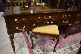 A selection of vintage dark stained bedroom furniture comprising dressing table, long chest and