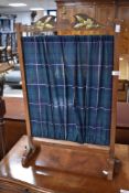 A vintage firescreen having tartan pattern linen screen, width approx. 52cm