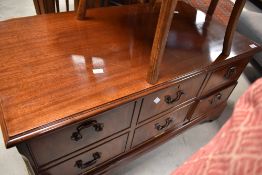 A reproduction TV cabinet having two drawers and drop down faux drawer section, width approx. 94cm