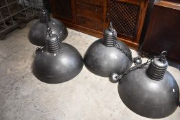 A set of four industrial style gun metal ceiling light fittings, approx. 70cm diameter