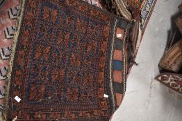 A selection of vintage Persian style carpet saddle bags etc