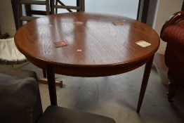 A vintage teak dining table having circular top, diameter approx. 122cm