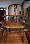 A 19th Century Windsor chair having repaired crinoline stretcher