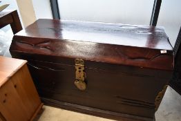 A large hardwood trunk of unknown origin with brass clasps and reinforcements etc , width approx