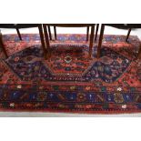 A traditional Persian rug approx. 205 x 127cm