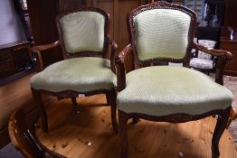 A pair of green dralon upholstered French design armchairs, seat height 46cm