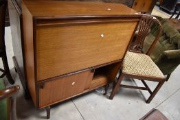 A vintage teak and ply shallow cocktail unit, width approx. 91cm