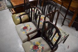 A group of five George III mahogany dining chairs, 4+1 carver, each with shaped top rail and