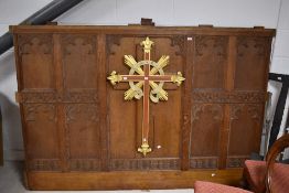 An ecclesiastical oak panel , with gilt heightened cruciform , width approx. 206cm, believed to have