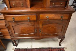 A late 19th/early 20th Century mahogany sideboard having ledge back , on cabriole legs, width