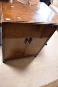 A vintage HMV record cabinet having compartmental interior, dimensions approx. W66 H82 D43cm
