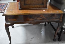 An early 20th Century mahogany coffee table having shaped apron and cabriole legs, dimensions