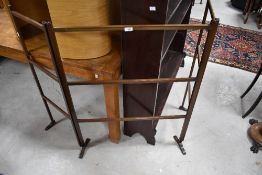 A 20th century three section clothes maiden/towel rail having two hinged ends sections 100cm