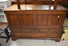 A 19th century oak and banded mahogany mule chest, of typical hinged rectangular form with an