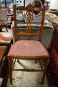 A Victorian bedroom chair having overstuffed seat and turned frame