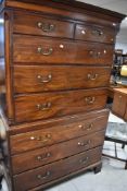 A 19th Century mahogany chest on chest , having dentil cornice, brass drop handles and bracket feet,