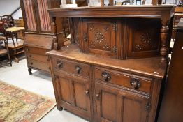 A reproduction Goome oak court cupboard, of traditional design 144cm x 137cm x 47cm