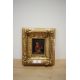 A small 19th century type oil on board/panel, a continental woman preparing fish, unsigned, within a - Image 2 of 3