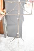 Black metal folding and extendable music stand, currently 130cm in height, with the ability to