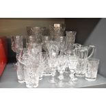 A selection of cut glass including vases and assorted drinking glasses